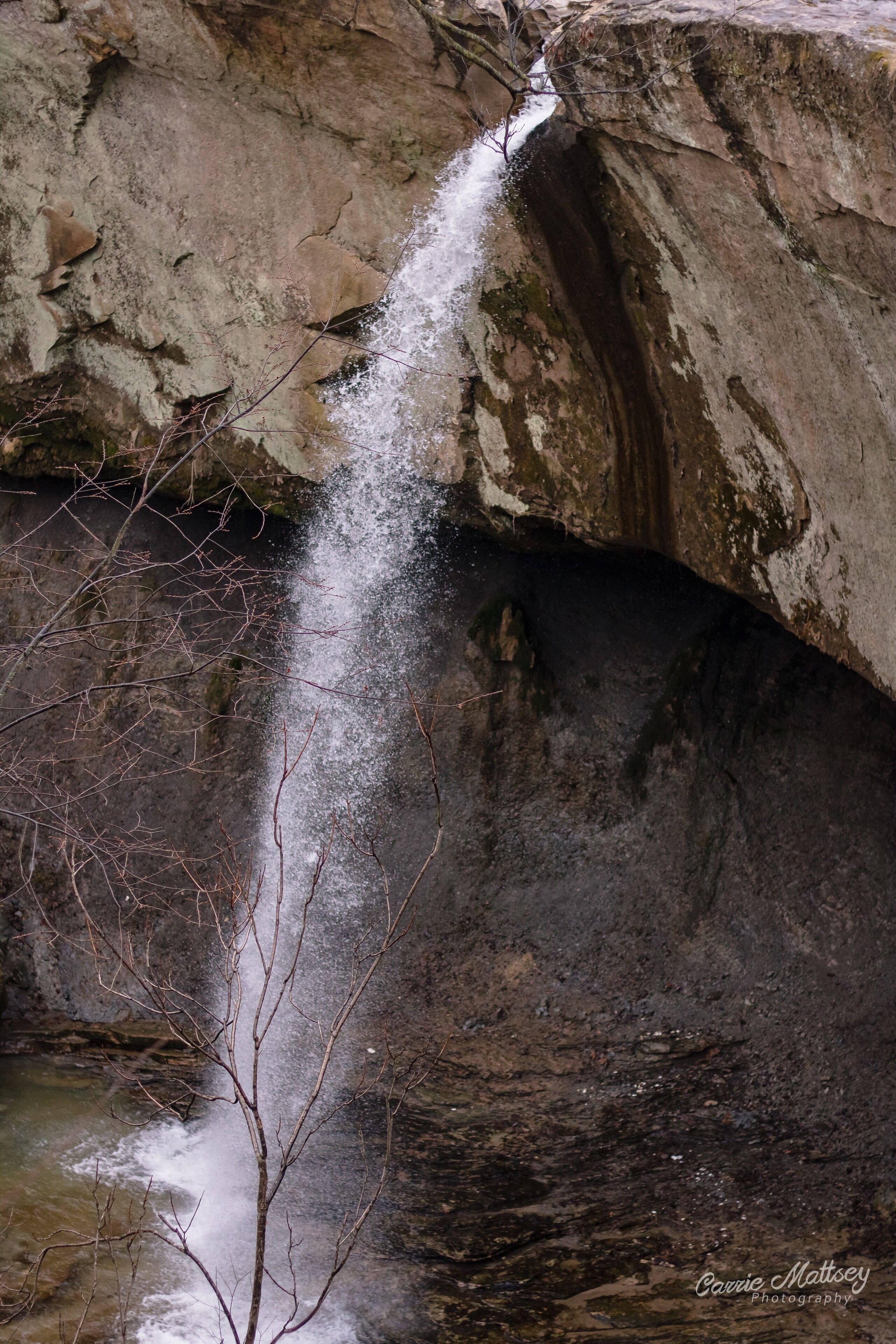 A waterfall cascading down a rocky cliff.