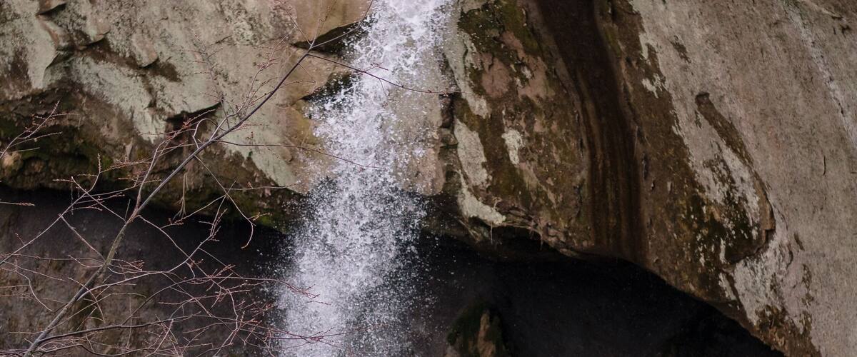 A waterfall cascading down a rocky cliff.