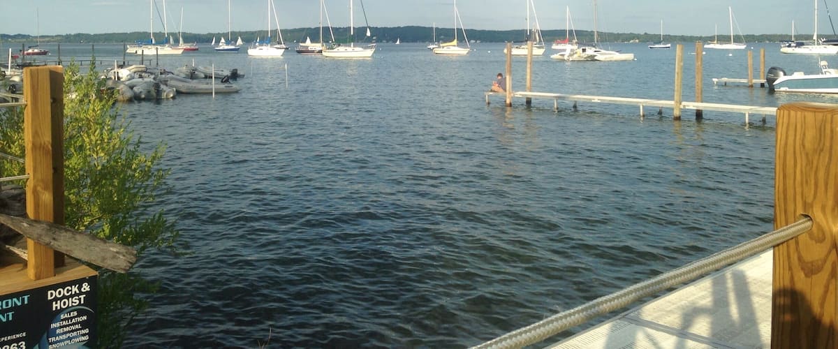 Gorgeous View from Apache Trout Grille in Traverse City. MI!  Excellent place for a #WeekendGetaway with the ladies!   Grab a drink or two outside on the picnic tables or at the water while you wait for your table!  
#girlsweekend #upnorth #mittenlove #girlsjustwannahavefun #travel #diagnosiswanderlust #travelblogger #summerbucketlist #TC #traversecity #wanderlust  #waterlust #puremichigan #DowntownTC 
#weekendgetaway