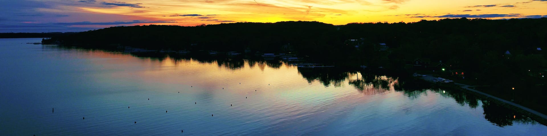 Orange sunset on a huge lake in autumn in Geneva, Wisconsin