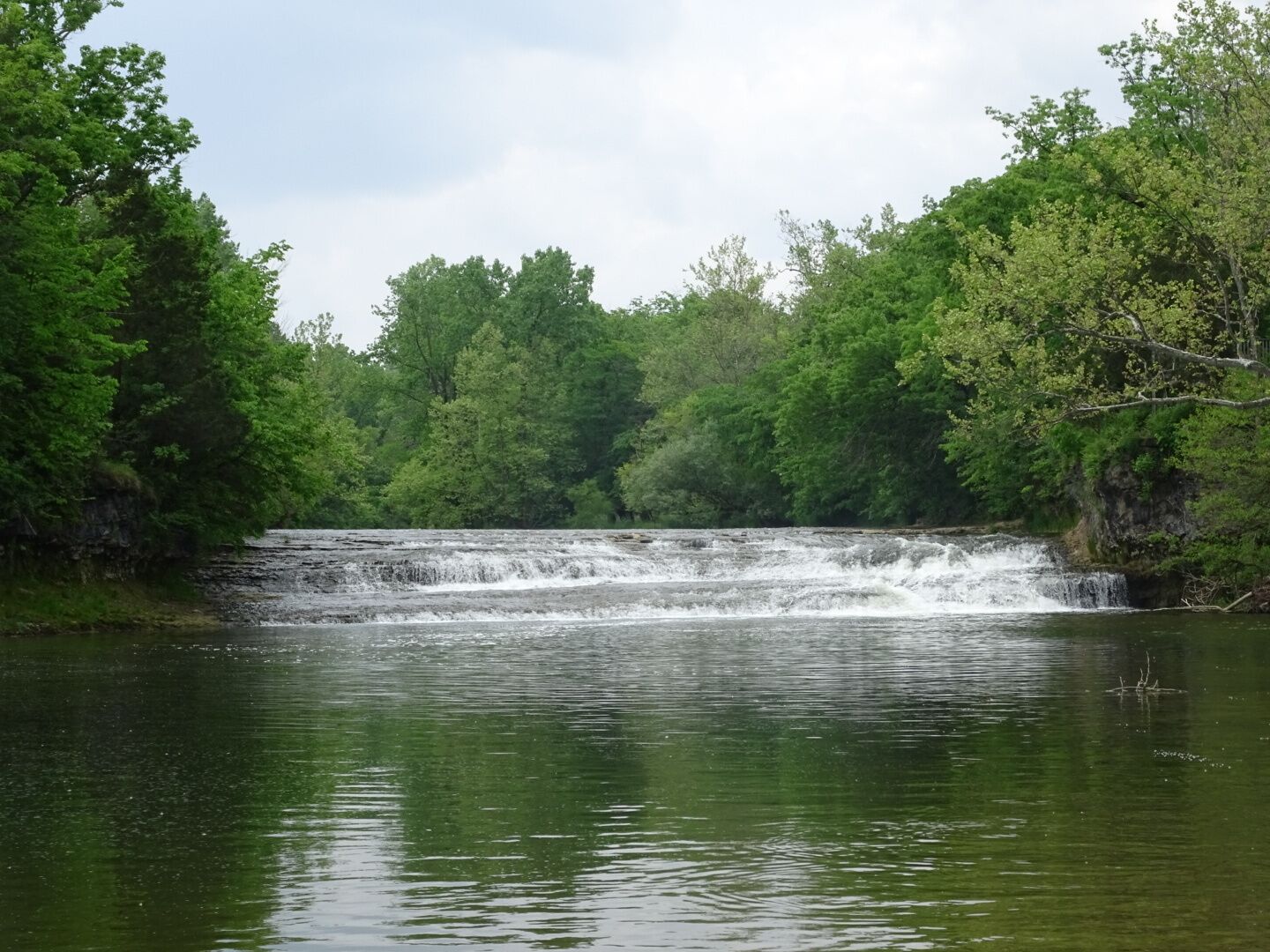 Greenville Falls State Scenic River Area is a 92-acre park on either side of Greenville creek with a 20-foot cascading fall and natural limestone arch.