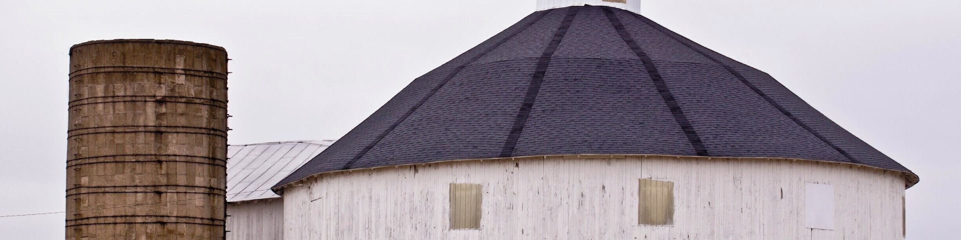 Just a short distance south of the new wind turbine farm I came across a round barn. There used to be a lot of those around here but they have slowly disappeared from the landscape. I only know of two others close. Sadly a large part of rural Indiana's history vanishing.