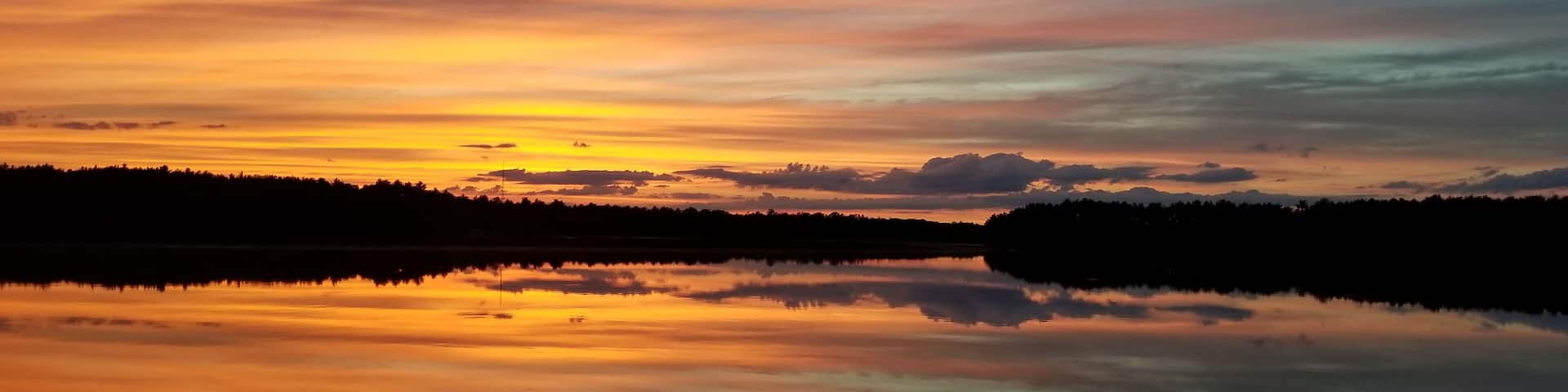 Sunset over Lake Dexter. Hot on one side, cool on the other.