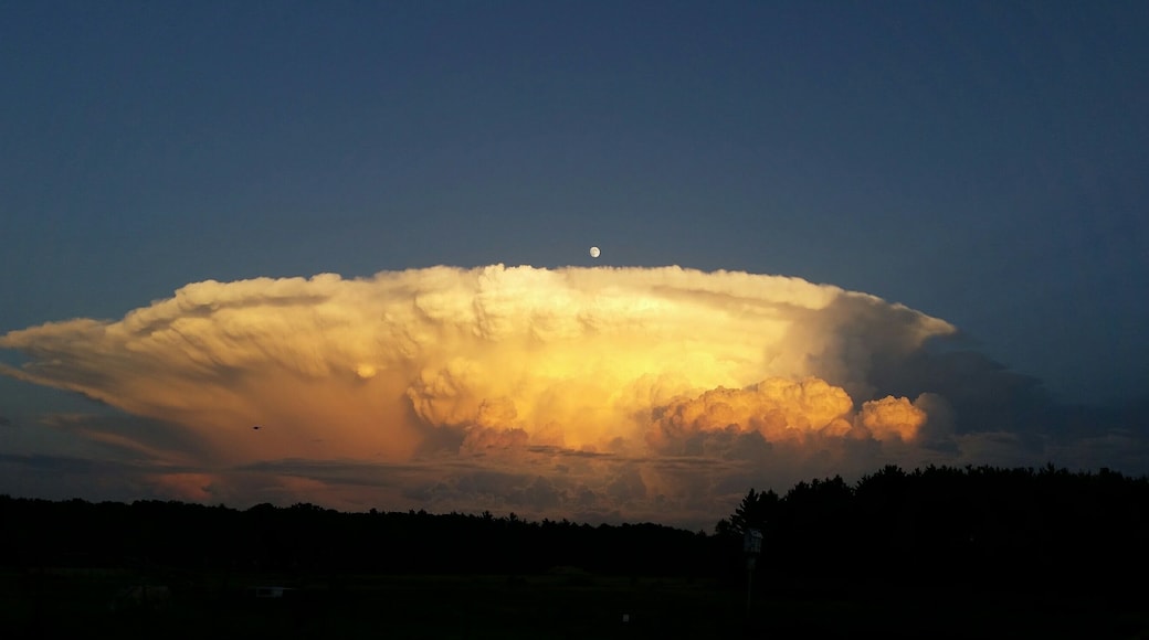 Taken from #Mybackyard in central Wisconsin looking to the southeast. My first thought was I hoped Chicago was okay! The moon is visible just over the cloud, center.