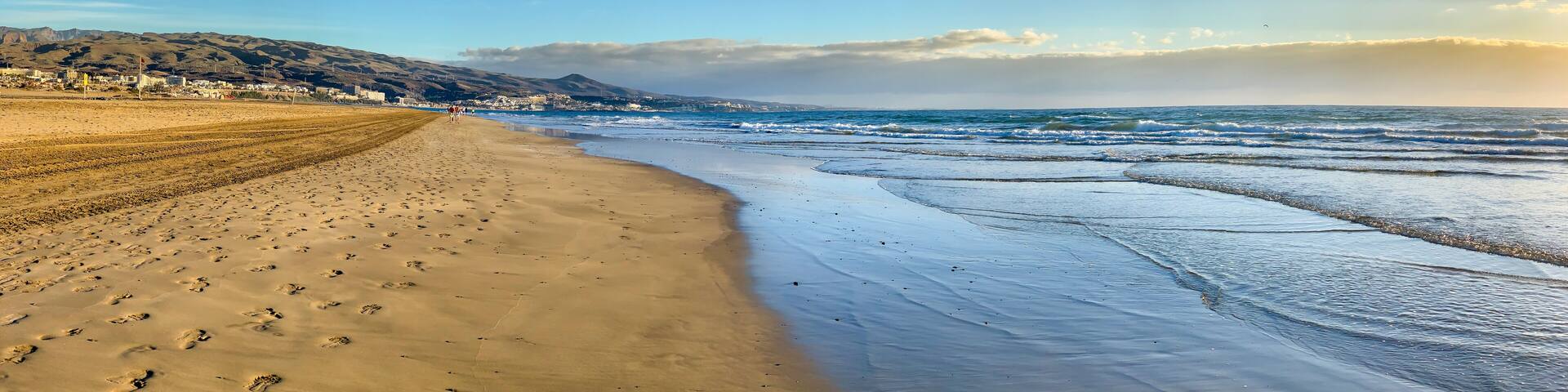 Sunrise in the famous beach "Playa del Ingles" in Maspalomas, Canary Islands. Low tide in the morning