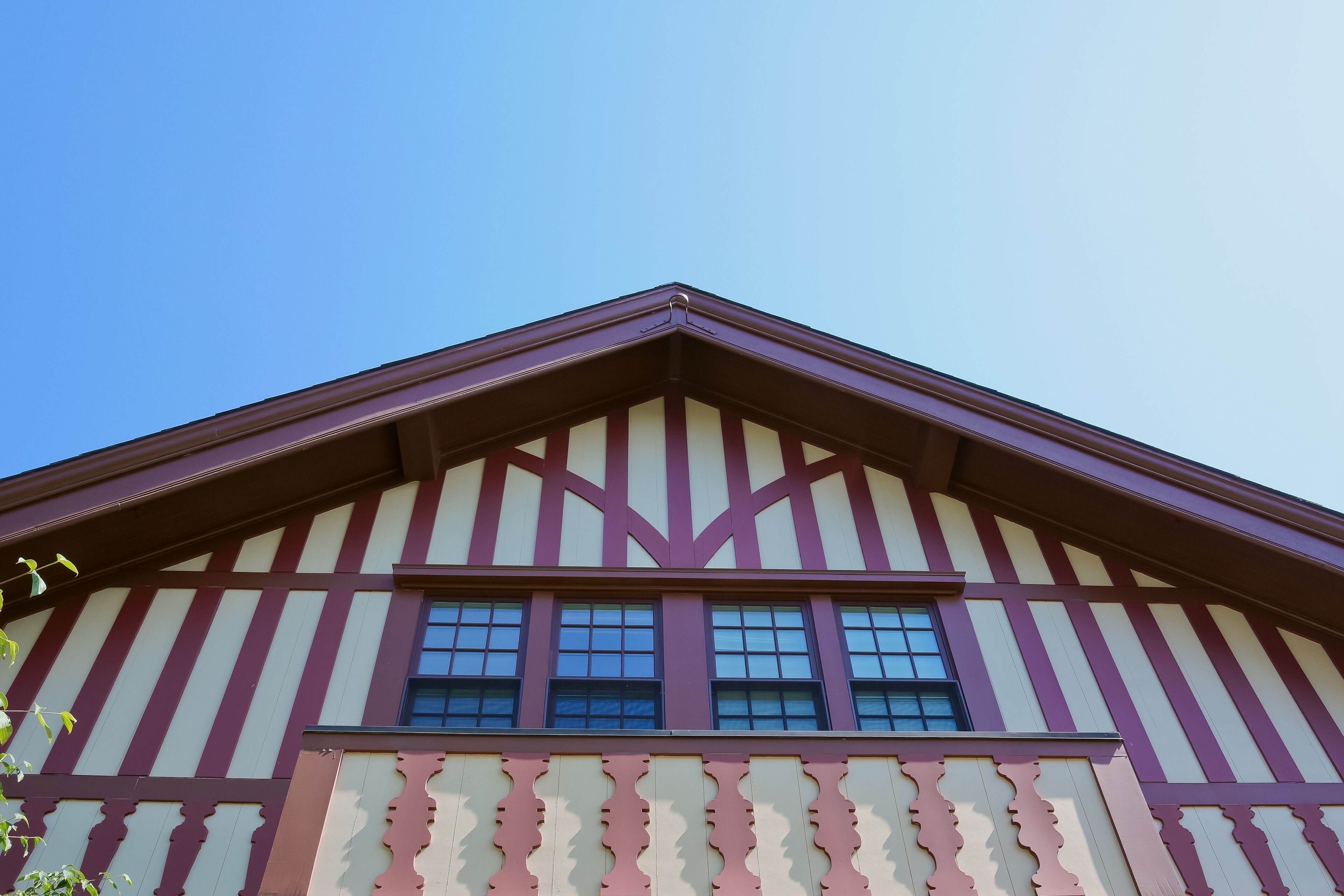 A building with a gabled roof and a striped facade.