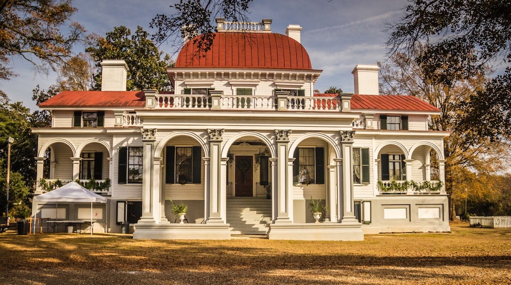 Kensington Plantation House is a historic plantation house located near Eastover, Richland County, South Carolina. It was built between 1851 and 1853, by Colonel Richard Singleton, a brother of Angelica Singleton Van Buren, daughter-in-law of President Martin Van Buren. The wood frame dwelling consists of a 2 1/2-story, central section with a Second Empire style copper covered dome, flanked by lower wings with arched colonnades. The front entrance features a porte-cochere with Corinthian order arches and pilasters.