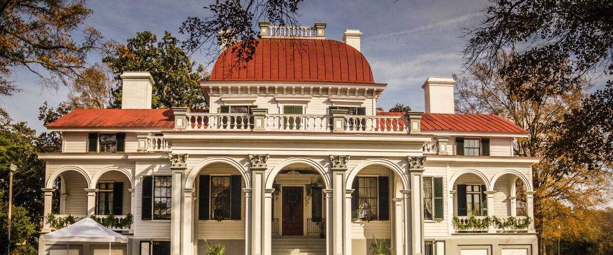 Kensington Plantation House is a historic plantation house located near Eastover, Richland County, South Carolina. It was built between 1851 and 1853, by Colonel Richard Singleton, a brother of Angelica Singleton Van Buren, daughter-in-law of President Martin Van Buren. The wood frame dwelling consists of a 2 1/2-story, central section with a Second Empire style copper covered dome, flanked by lower wings with arched colonnades. The front entrance features a porte-cochere with Corinthian order arches and pilasters.