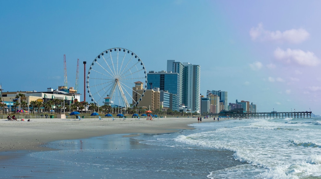 Panoramic view of Myrtle Beach, South Carolina with beach, hotels, ferris wheel, and boardwalk.