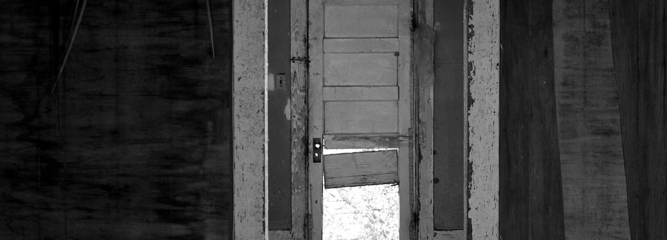 This was another photo from my trip back in July 2014. It was a house that was sitting alone on the side of the road. There was no front door so you could stand on the cement porch steps and see straight in.
This was taken looking through the front door right to the back. It had obviously seen hard times with the warped floor and the torn water stained walls. There was still something quiet and peaceful about it though, as if the house accepted that it had been left behind. And as there was no sign of any person having been around for a long time, there were signs of wildlife. Birds, Lizards and the largest grasshoppers I had ever seen were just a few of the things scurrying around.
I do not suggest waking into the building at all if you stop while passing by. The floor could be unsteady. #architecture
#roadtrip