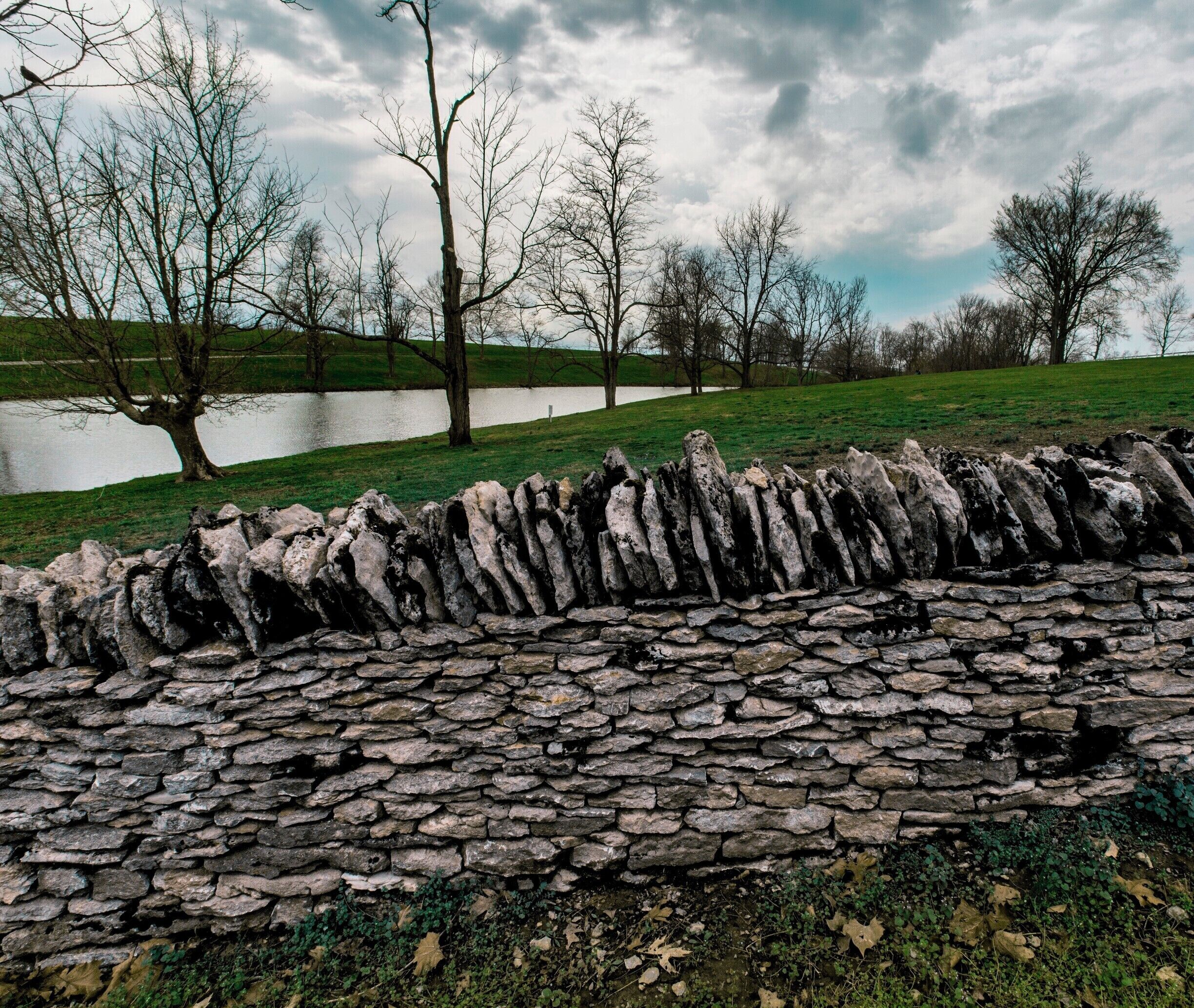 On this site from 1800-1900 Shakers called this beautiful farm home. raising cattle, making wooden furniture, and preaching. This was their lake and wall to partition their land from the next farm. This is a wonderful village, vibrant with artisans during the summer where you can learn crafts, buy locally made products, and participate in events. From 9 Am-6 PM each day they have interactive exhibits, cultural programs, and traditional food.
for some more information go to 
http://shakervillageky.org/ 