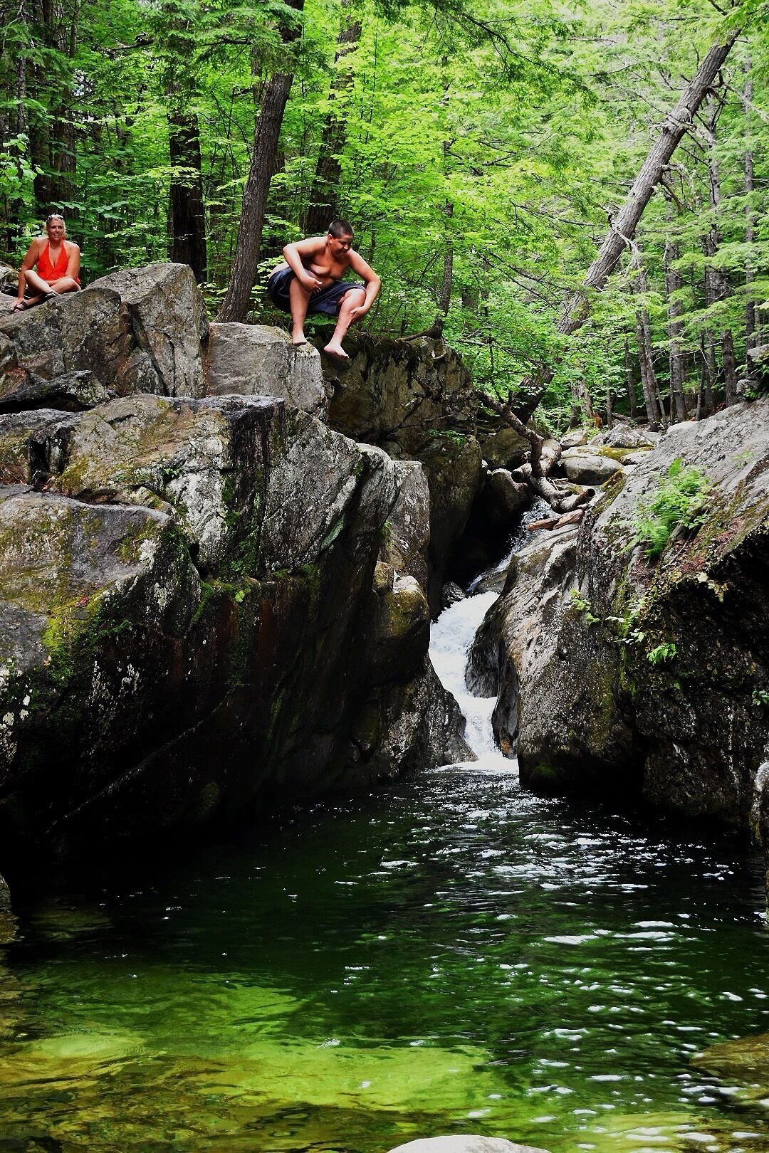 Greenish tint to the crystal clear water caused by minerals on a secluded hillside stream.
