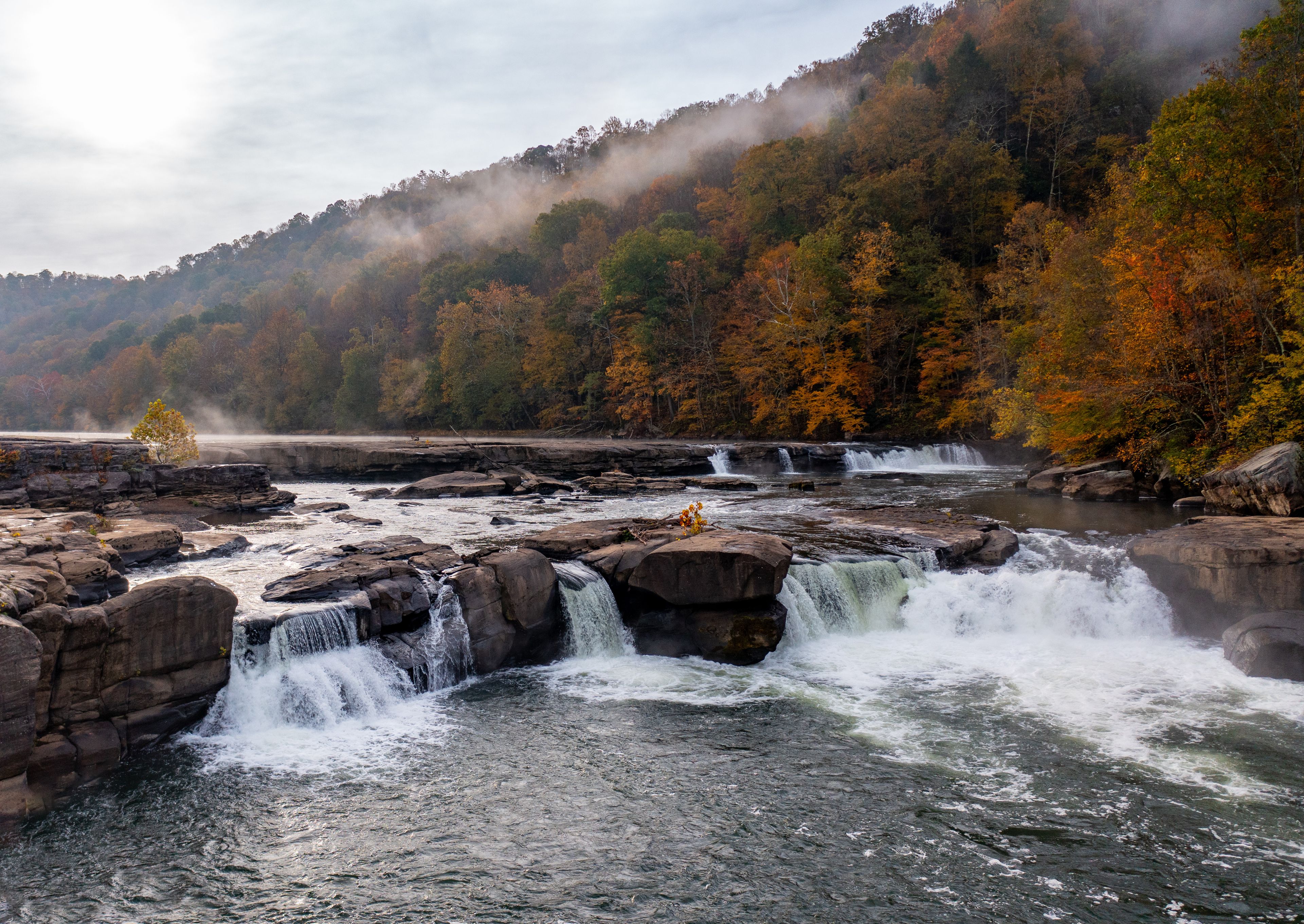 Valley Falls State Park near Fairmont in West Virginia on a colorful misty autumn day with fall colors on the trees