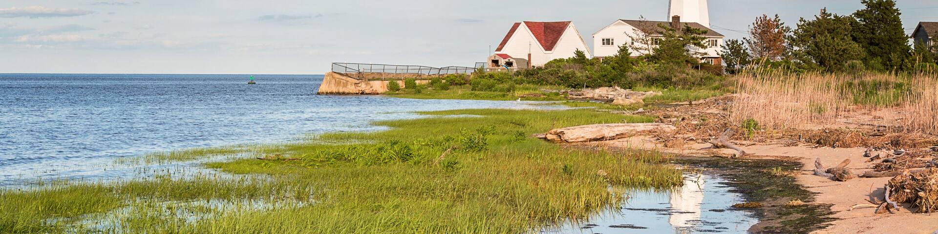 lighthouse reflected in the water