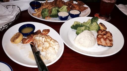 Delicious Red jumbo lobster tail, coconut prawn, baked salmon n french fries,