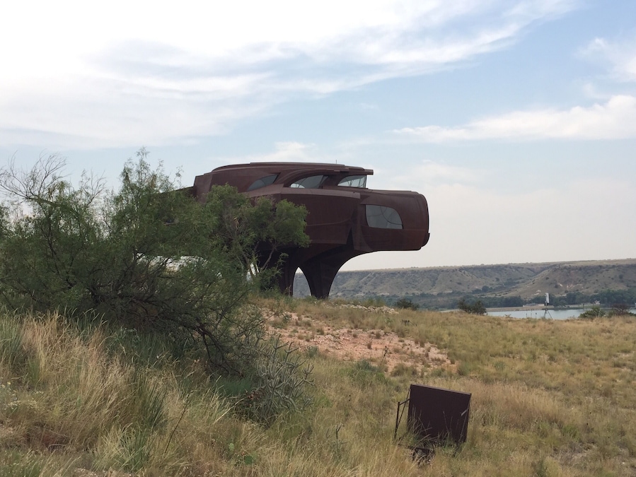 One of the most unique styled homes in the world, what looks like something straight out of a sci-fi movie is an unfinished project by the late sculptor and designer Robert Bruno. The home now sits vacant and looms over the vast waters of Ransom Canyon.