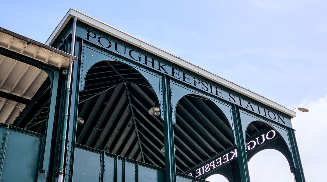 poughkeepsie station sign on entrance to metro railroad stop (north rail commuter platform) travel north east northeast corridor city new york