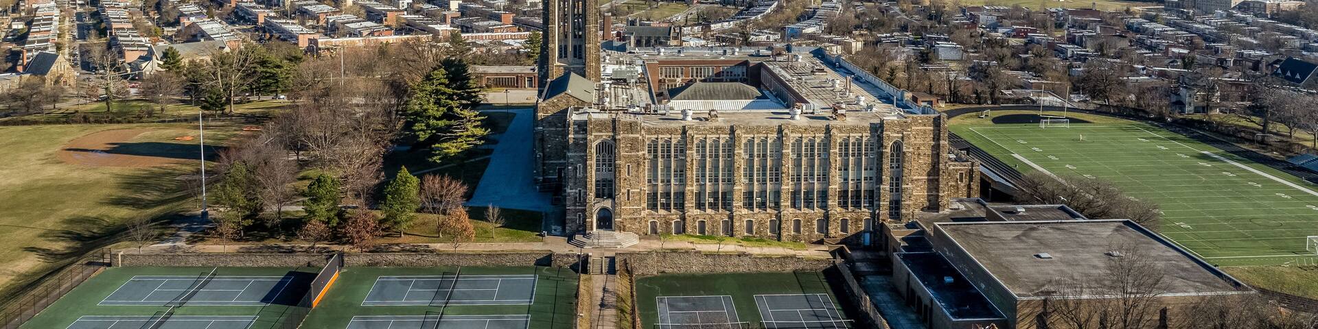 Aerial view of Baltimore City College, liberal arts college preparatory school in Baltimore Homestead Montebello neighborhood built of granite and limestone in a Collegiate Gothic architectural style