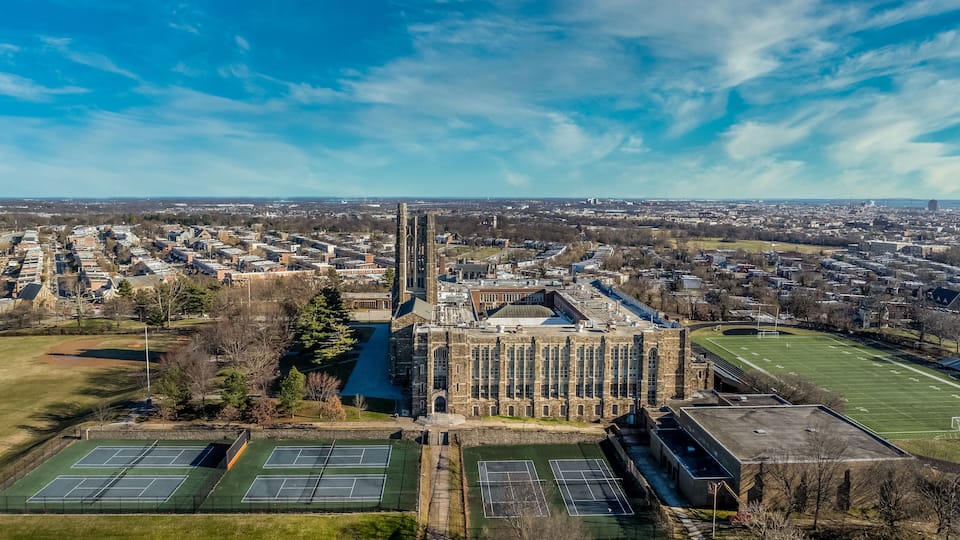 Aerial view of Baltimore City College, liberal arts college preparatory school in Baltimore Homestead Montebello neighborhood built of granite and limestone in a Collegiate Gothic architectural style