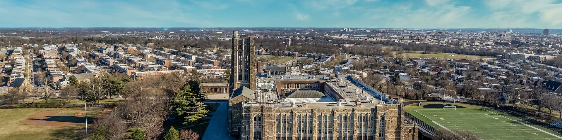 Aerial view of Baltimore City College, liberal arts college preparatory school in Baltimore Homestead Montebello neighborhood built of granite and limestone in a Collegiate Gothic architectural style