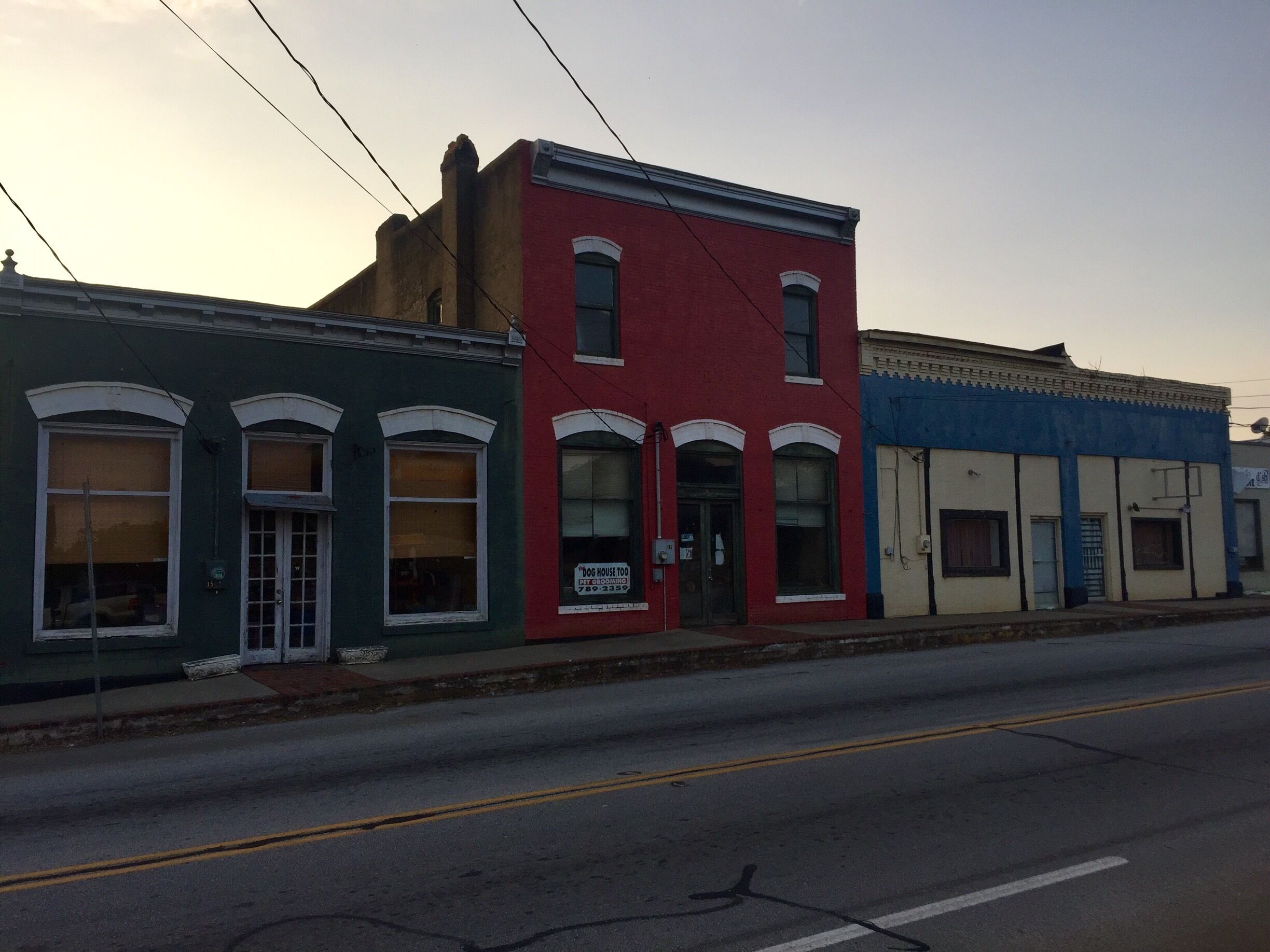 A row of colorful buildings along a street.