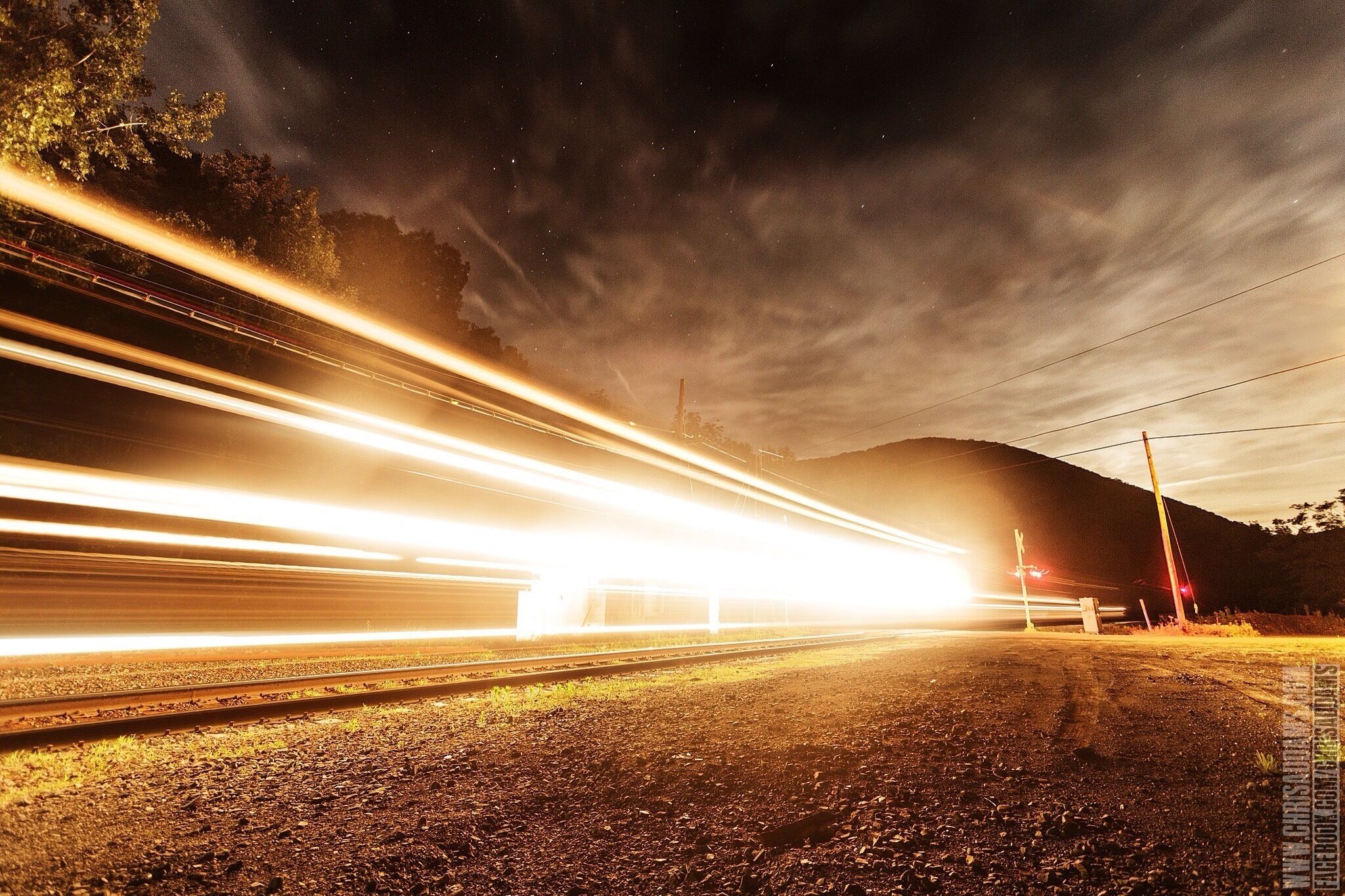 A freight train passes over the Deerfield River and enters the east portal of the Hoosac Tunnel.

See more are www.facebook.com/chrisaddams 
