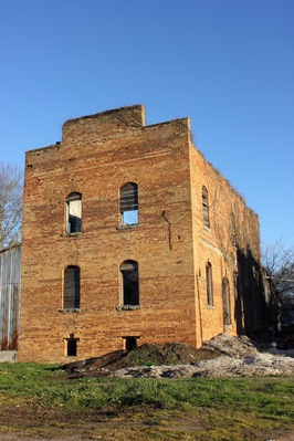 An abandoned warehouse building once used to store fertilizer in the small cotton farming town of Bostwick, GA.