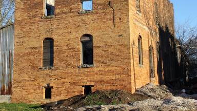 An abandoned warehouse building once used to store fertilizer in the small cotton farming town of Bostwick, GA.
