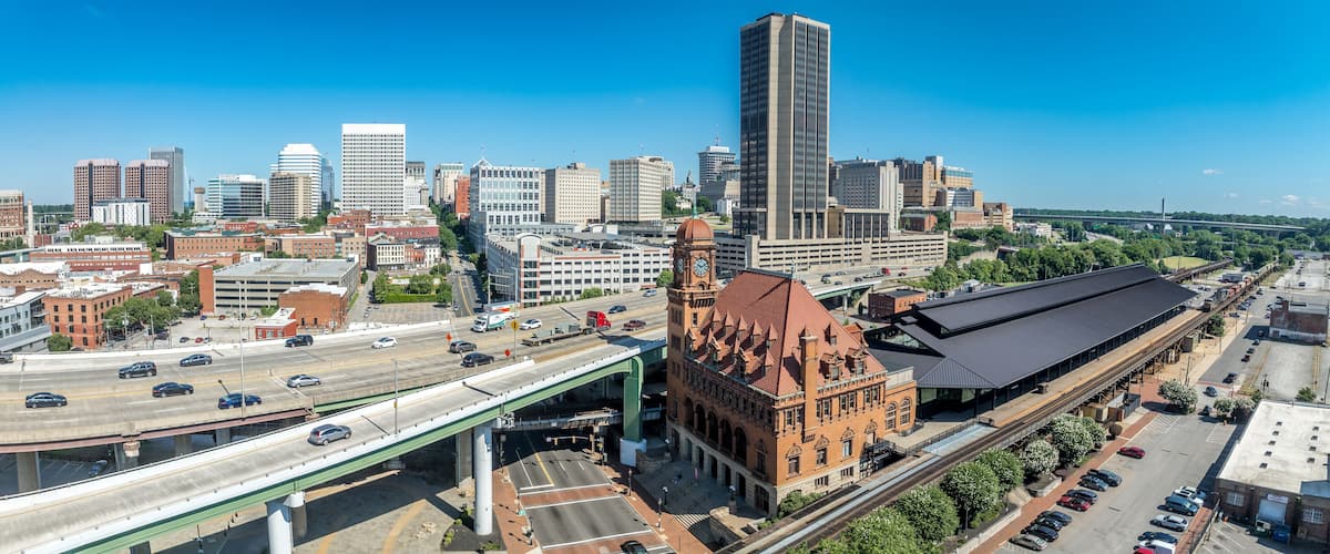 Aerial view of downtown Richmond with skyscrapers, historic Main Street train station