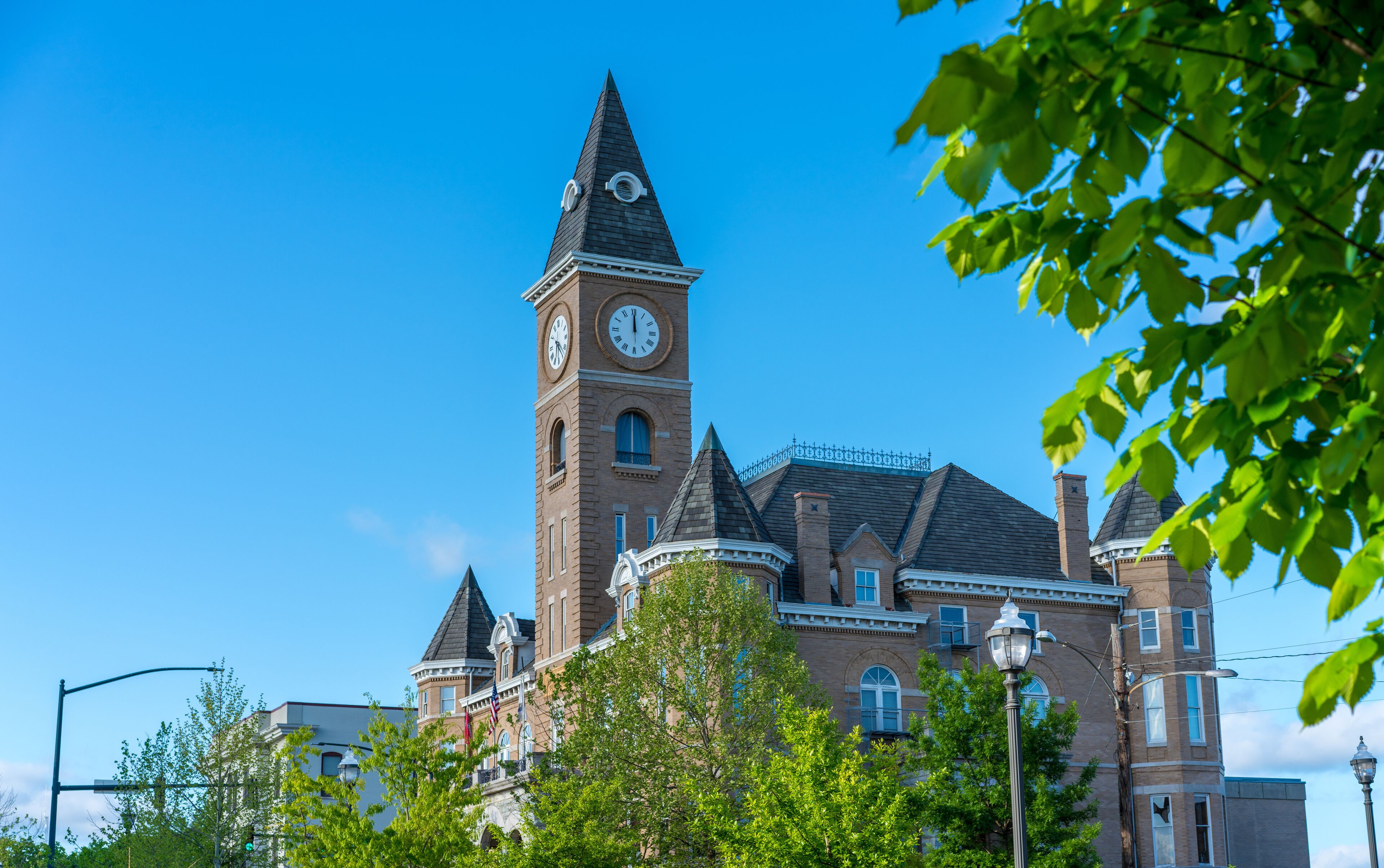 A historic building with a clock tower and a turret.