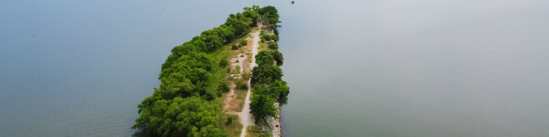Aerial view the original breach of the Lake Dallas Dam aka The Cut divides the upper and lower halves of Lake Lewisville, Texas, America