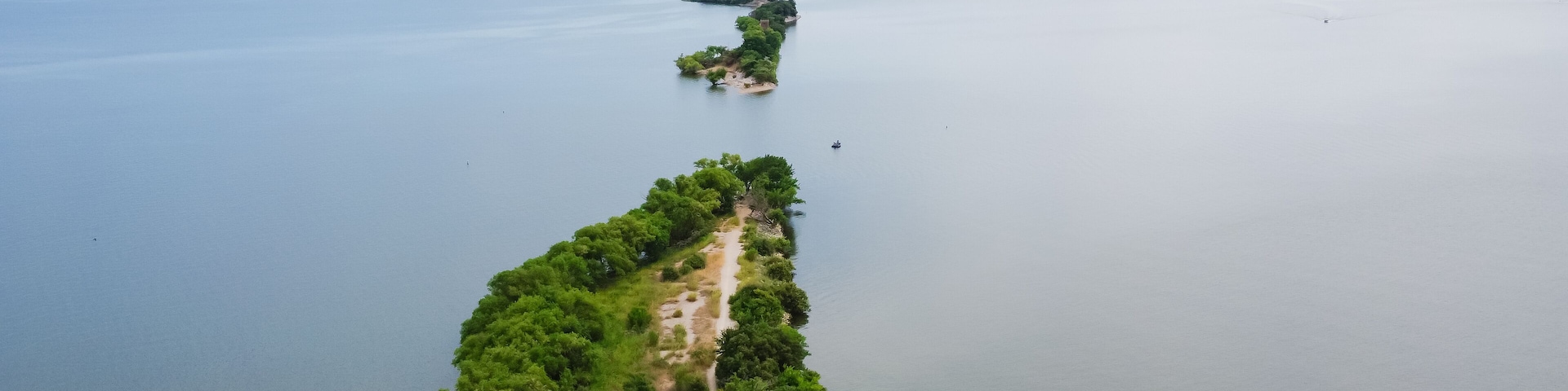 Aerial view the original breach of the Lake Dallas Dam aka The Cut divides the upper and lower halves of Lake Lewisville, Texas, America