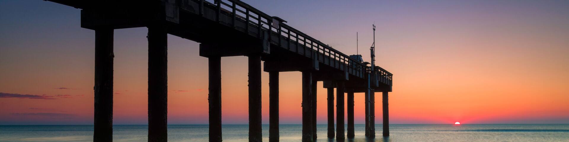Sunrise at St. John's Pier, St. Augustine, Florida.