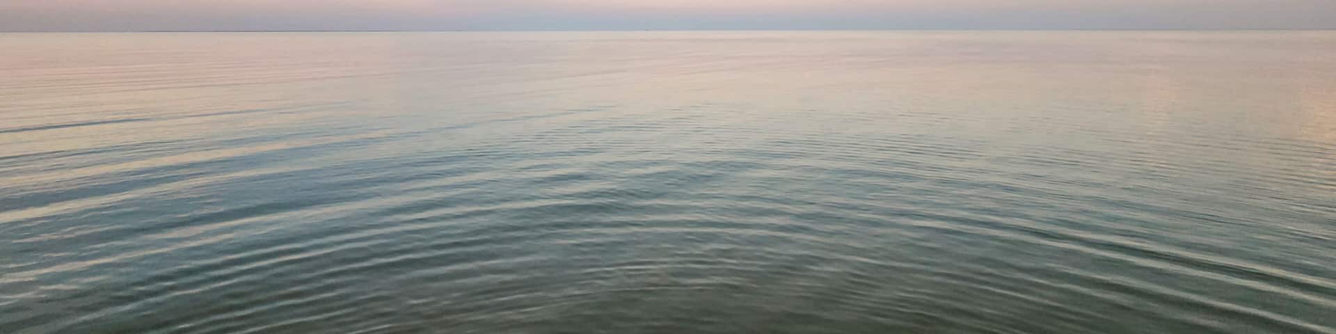 A scenic sunrise view of Indianola Beach in Port Lavaca, Texas.