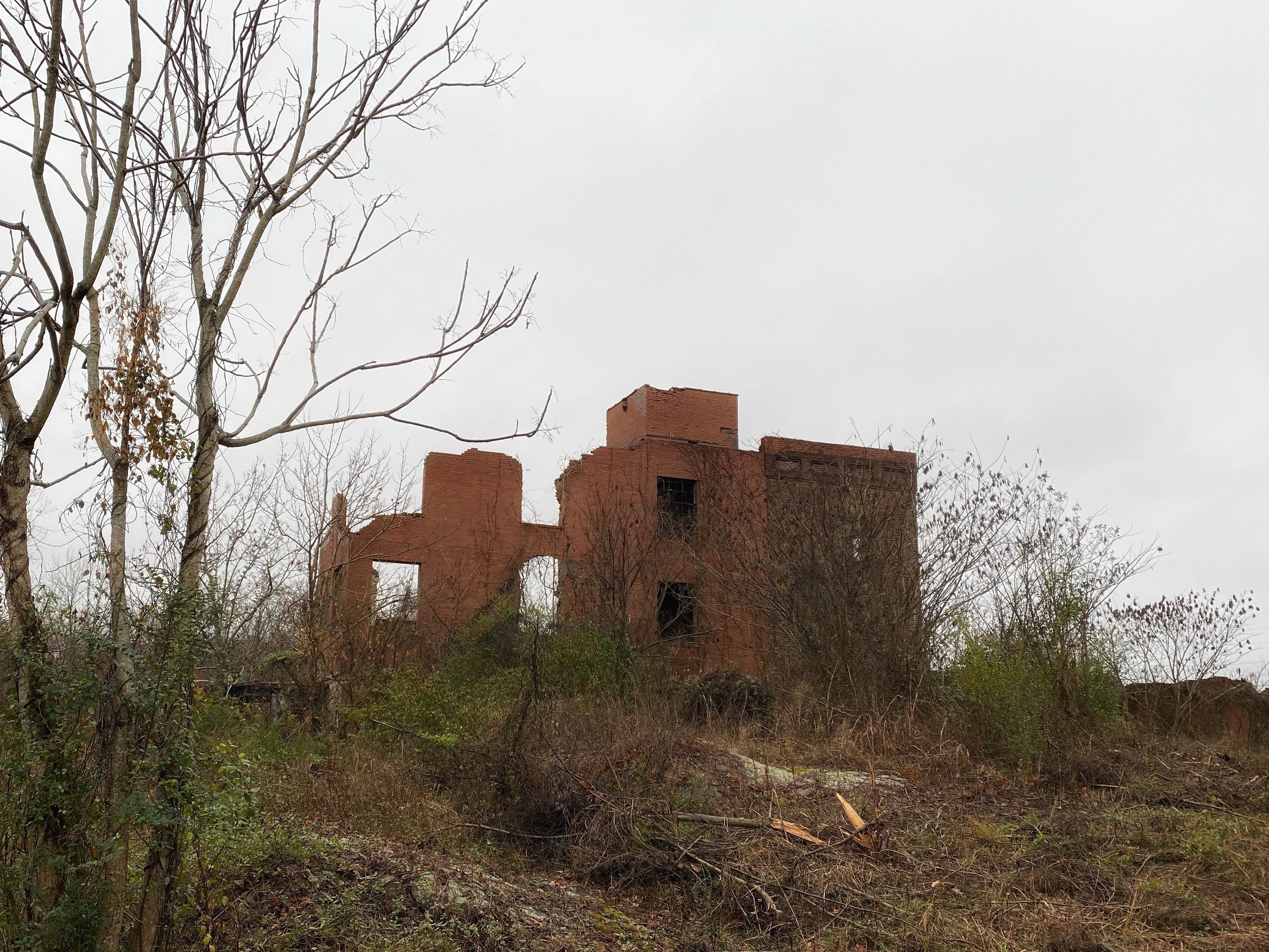 Nice little park with some old mill buildings, bridge, and river.