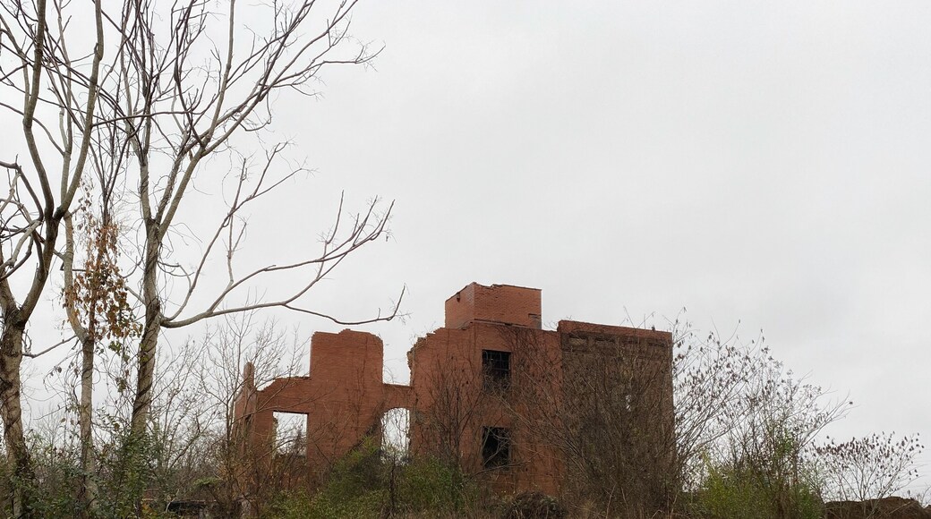 Nice little park with some old mill buildings, bridge, and river.