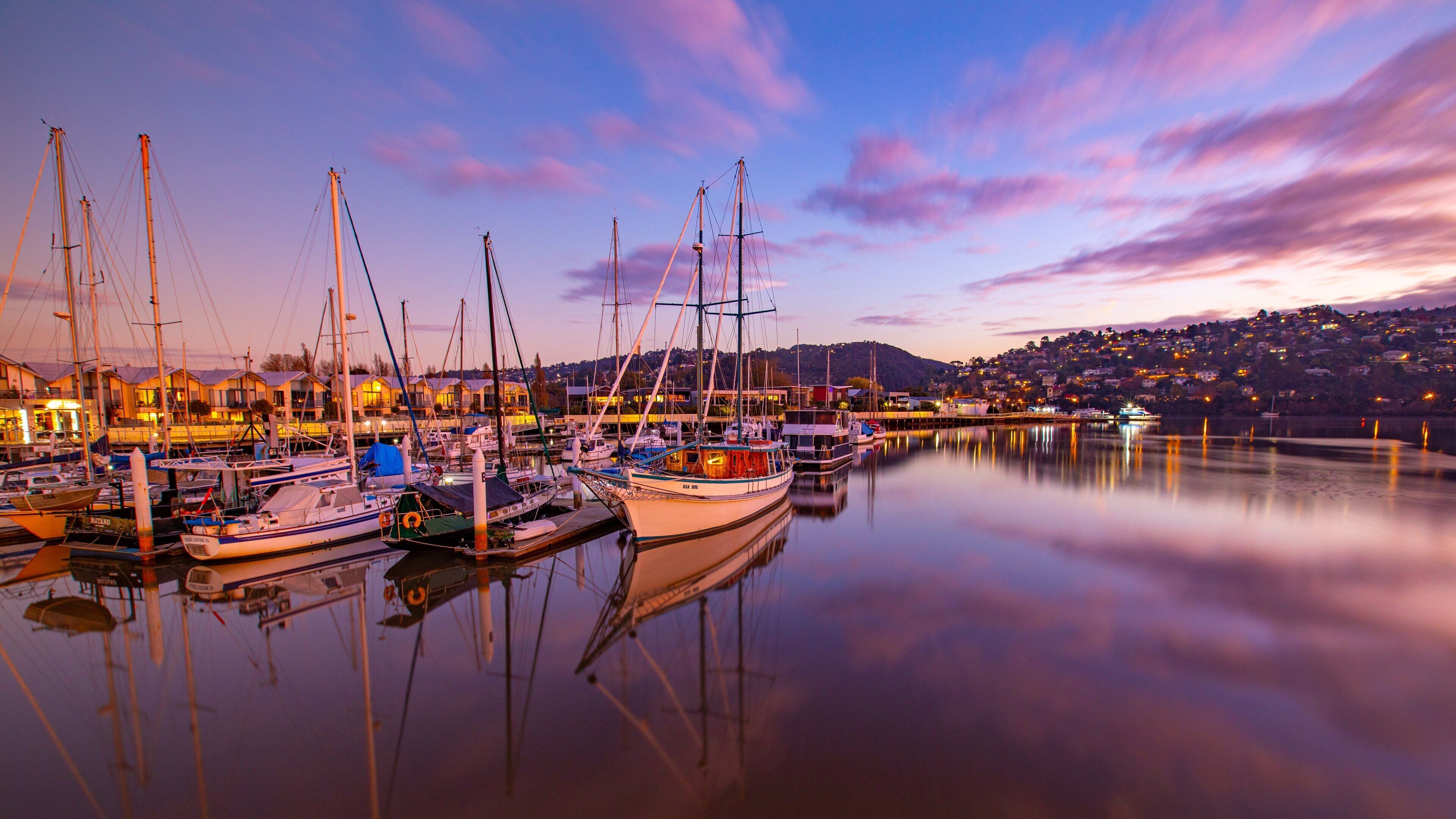 Launceston featuring a sunset and a bay or harbor