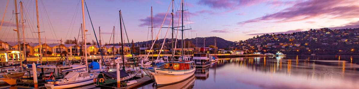 Launceston featuring a sunset and a bay or harbor