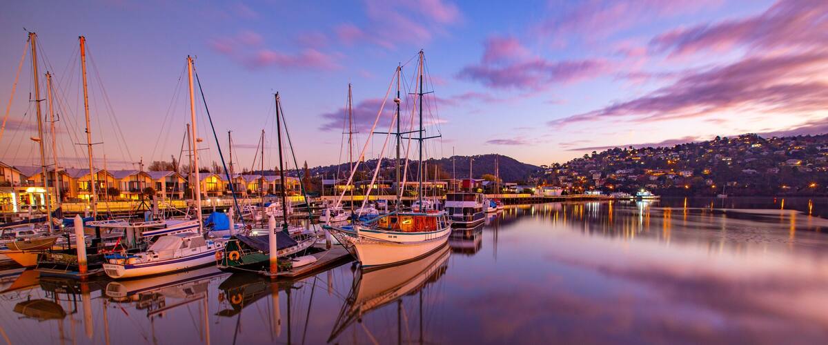 Launceston featuring a sunset and a bay or harbor