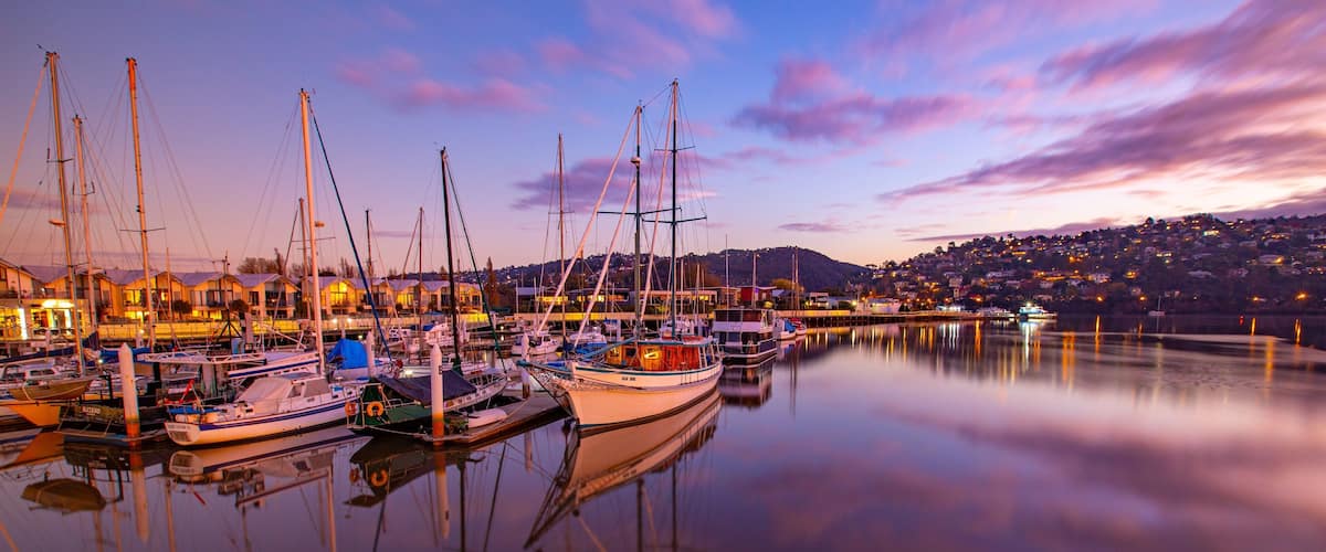 Launceston featuring a sunset and a bay or harbor