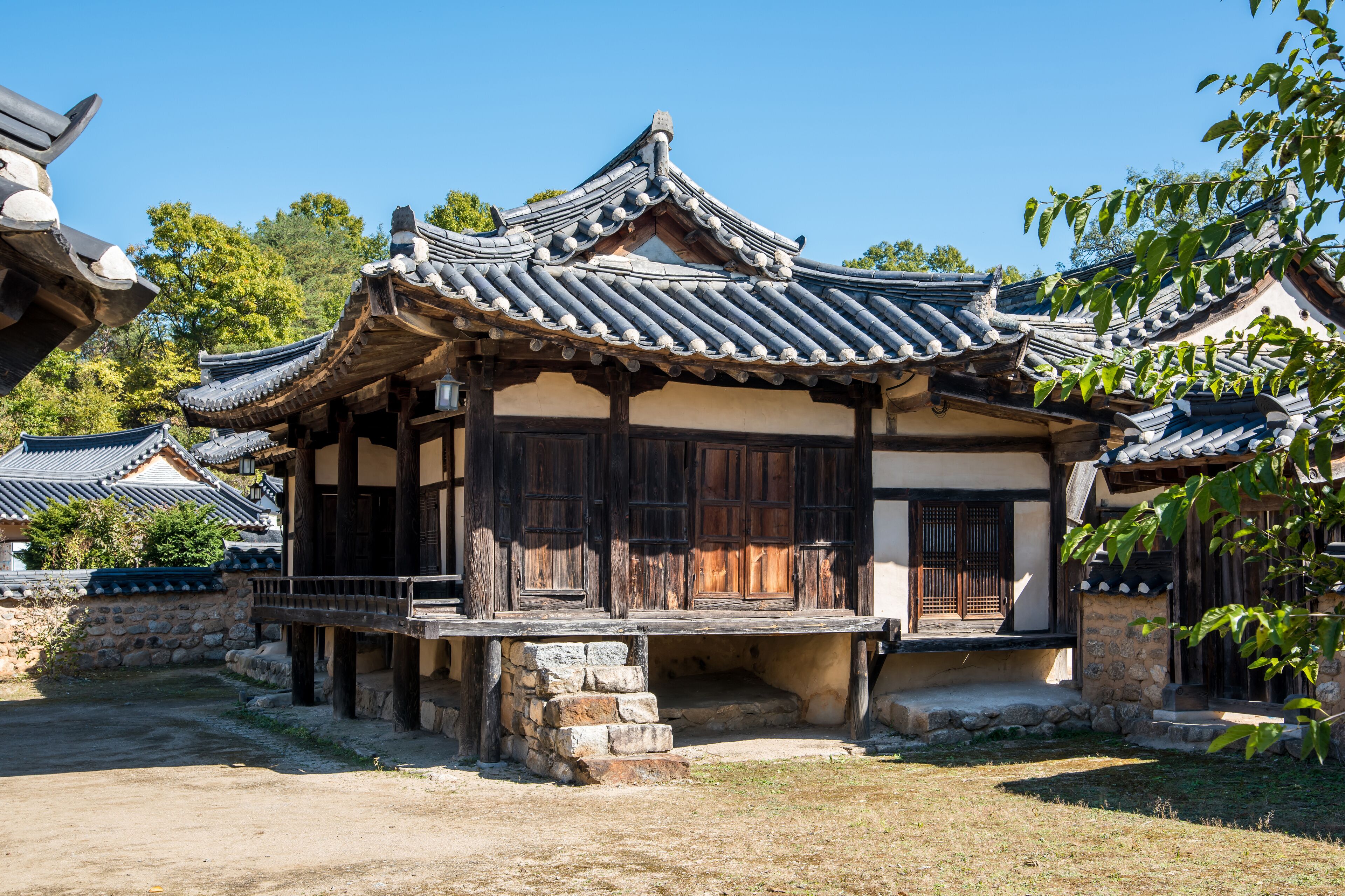 A traditional Korean building with a tiled roof and wooden structure.