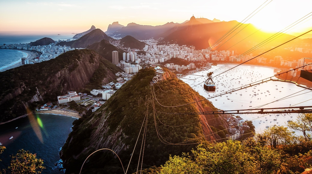 Sugar Loaf Mountain Cable Car Overlooking Christ The Redeemer Statue in Corcovado Mountain and Guanabara Bay, Rio de Janeiro - Brazil