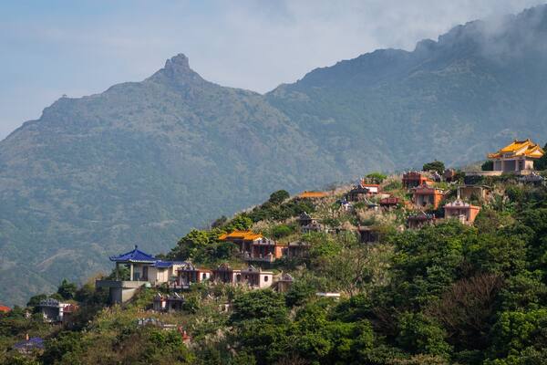 Jinguashi Geopark featuring mountains, a small town or village and tranquil scenes