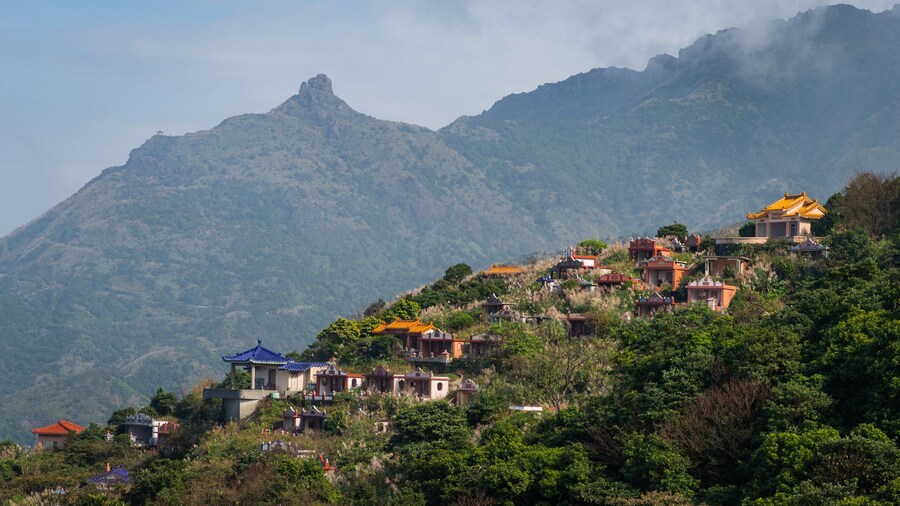 Jinguashi Geopark featuring mountains, a small town or village and tranquil scenes