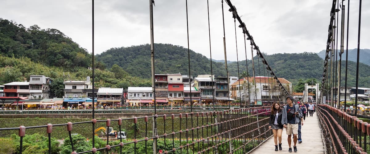 Shifen featuring a bridge, a small town or village and a river or creek