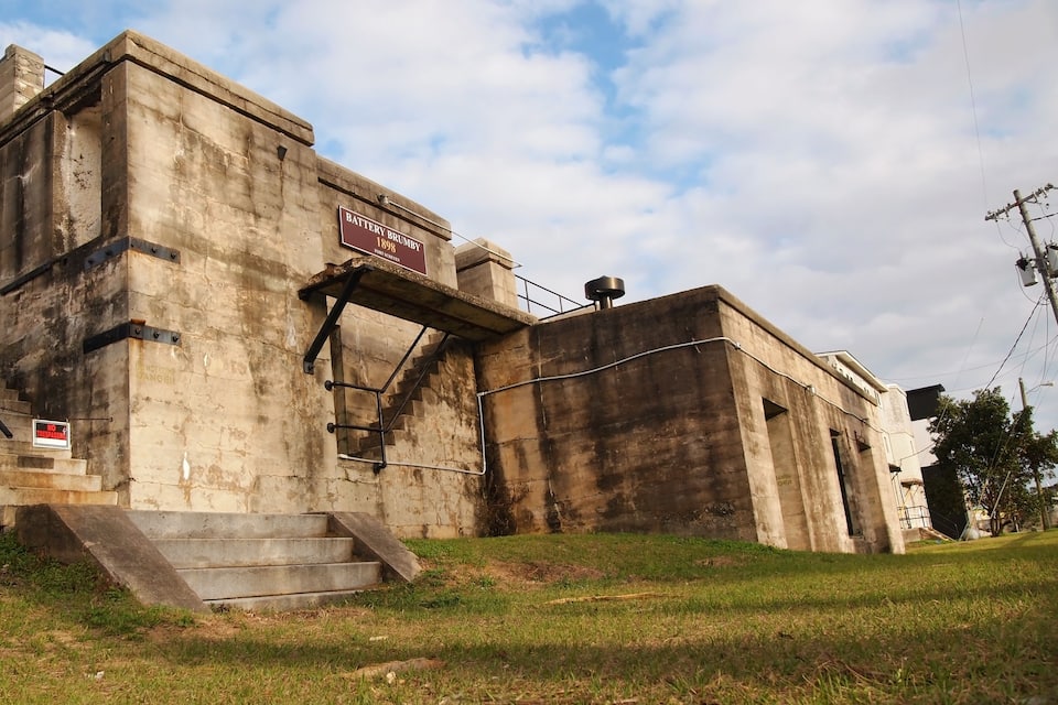 An old, weathered building with a sign reading "Battery Brauery 1899".