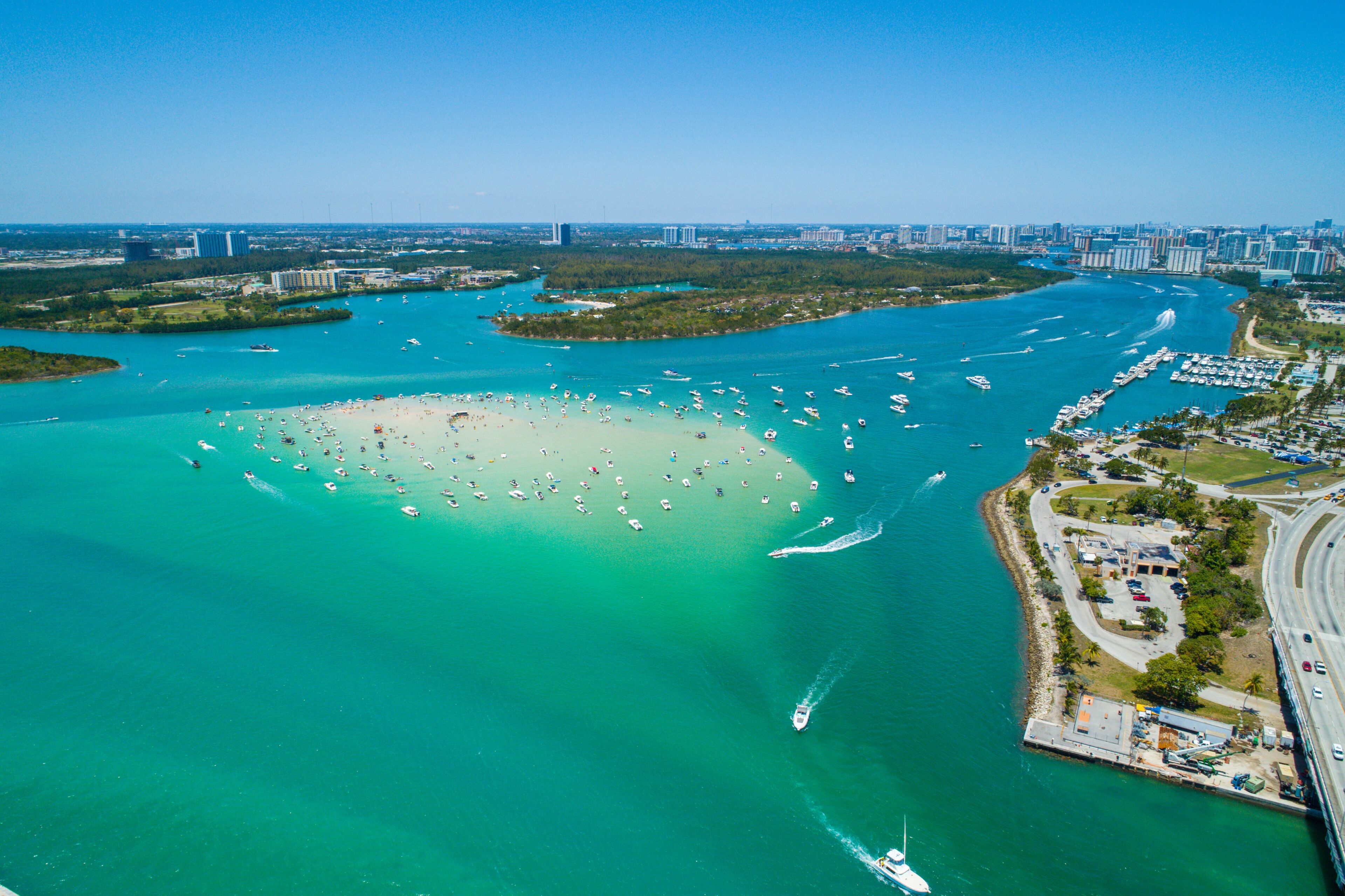 Aerial drone image of Haulover Beach Miami Florida sandbar with boats crowded on the weekend