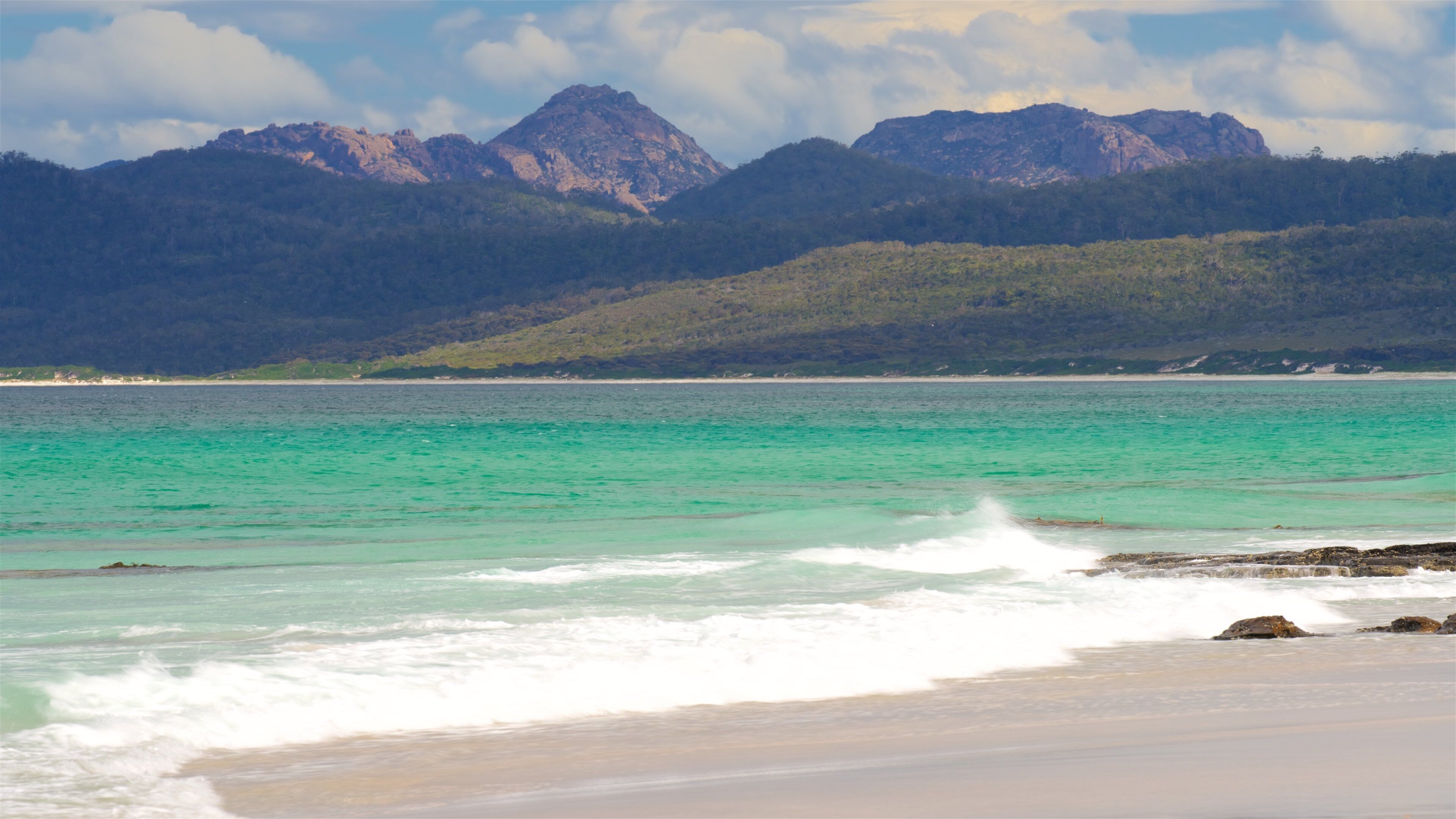 Friendly Beaches which includes general coastal views and a sandy beach