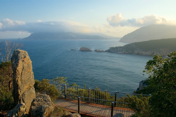 Cape Tourville Lighthouse featuring views, general coastal views and a sunset