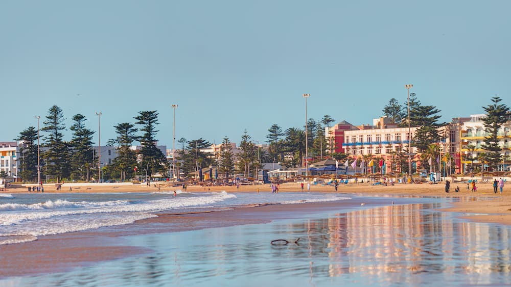 General view of the city beach with holidaymakers on the beach - Essaouira, Morocco